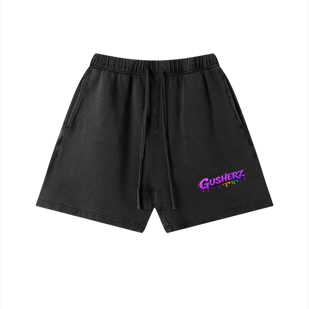 Black drawstring shorts with a purple and multicolor 'GUSHERZ' graphic on the left leg, displayed on a clean white background.