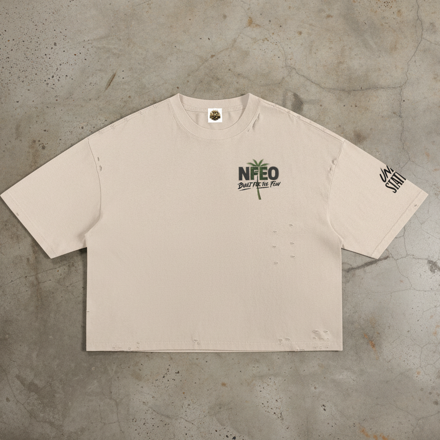 Signature designer streetwear t-shirt featuring a structured boxy silhouette and raw distressed edge detailing. The front features minimalist signature branding, while the back displays the iconic NFEO and Built For The Few graphic logo. This premium heavy cotton garment represents the entrepreneurial struggle and exclusive streetwear aesthetic. Engineered for a relaxed urban fit, this essential statement piece is crafted for those who value individuality, resilience, and high-end fashion