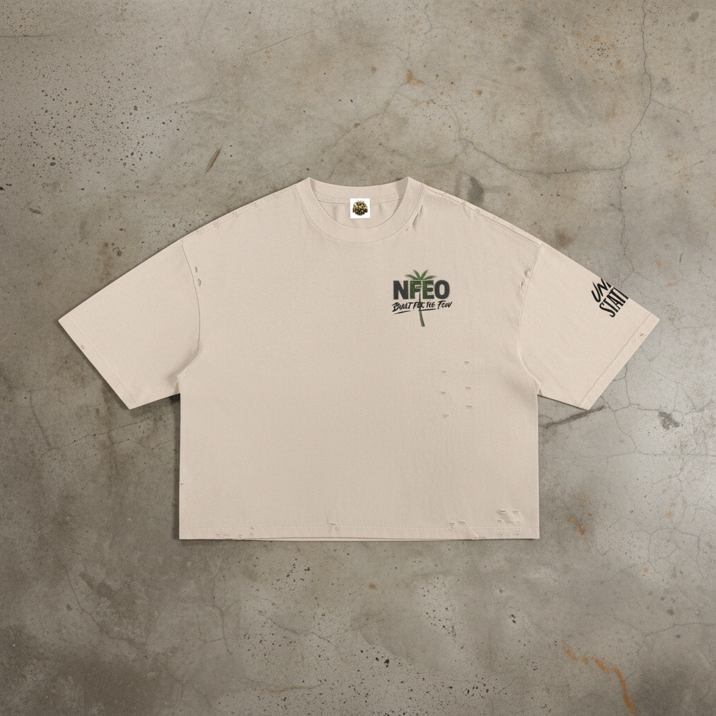 Signature designer streetwear t-shirt featuring a structured boxy silhouette and raw distressed edge detailing. The front features minimalist signature branding, while the back displays the iconic NFEO and Built For The Few graphic logo. This premium heavy cotton garment represents the entrepreneurial struggle and exclusive streetwear aesthetic. Engineered for a relaxed urban fit, this essential statement piece is crafted for those who value individuality, resilience, and high-end fashion