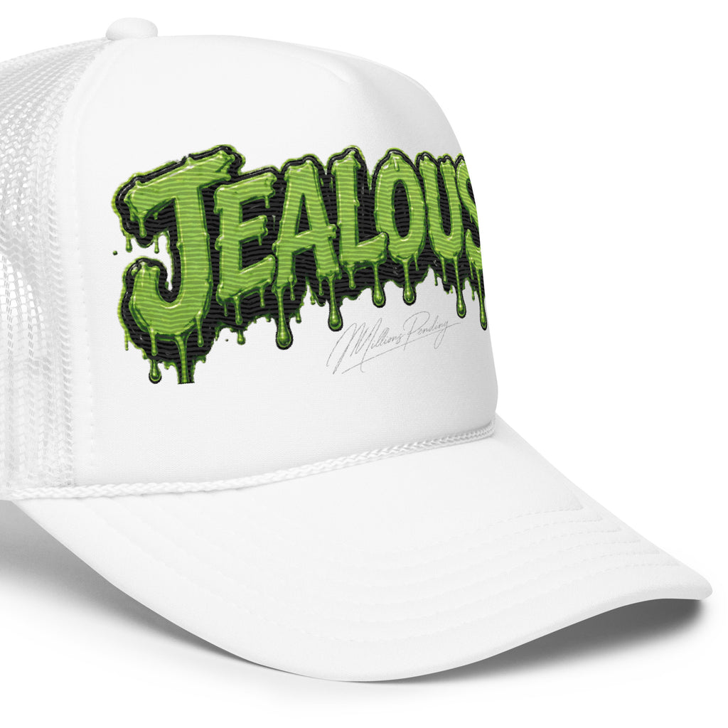 All white Jealousy cannabis strain foam trucker hat with raised 3D embroidered lettering, detailed stitching, structured foam front and breathable mesh back, designed as premium cannabis-inspired streetwear headwear in black, white and red colorways.