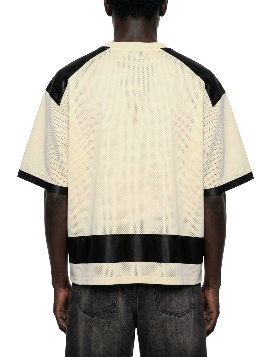 Black male model wearing the NFEO Millions Pending oversized boxy mesh raglan tee in a premium luxury streetwear lifestyle setting, showcasing the [BACK/VIEW], heavyweight 255 GSM breathable mesh fabric, drop shoulder fit, oversized silhouette, premium craftsmanship, and exclusive entrepreneur-inspired design. Styled with matching NFEO Millions Pending platform sneakers for a complete coordinated streetwear collection. Not For Everyone. Built For The Few.