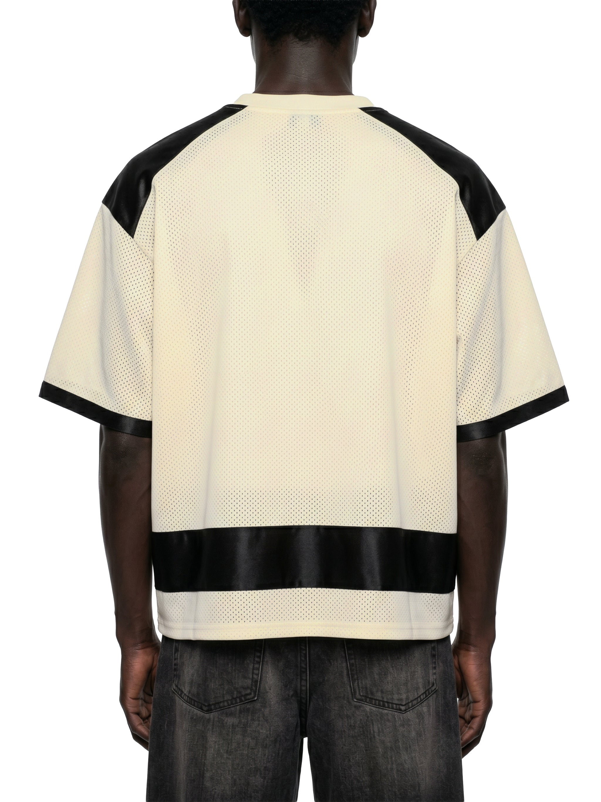 Black male model wearing the NFEO Millions Pending oversized boxy mesh raglan tee in a premium luxury streetwear lifestyle setting, showcasing the [BACK/VIEW], heavyweight 255 GSM breathable mesh fabric, drop shoulder fit, oversized silhouette, premium craftsmanship, and exclusive entrepreneur-inspired design. Styled with matching NFEO Millions Pending platform sneakers for a complete coordinated streetwear collection. Not For Everyone. Built For The Few.
