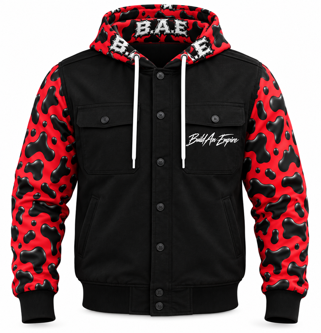 B.A.E. Build An Empire red and black cow print hooded jacket front view, featuring glossy cow-print sleeves and hood, black body, button-front closure, dual chest flap pockets, lower hand pockets, white drawstrings, ribbed cuffs and hem, and Build An Empire chest script.