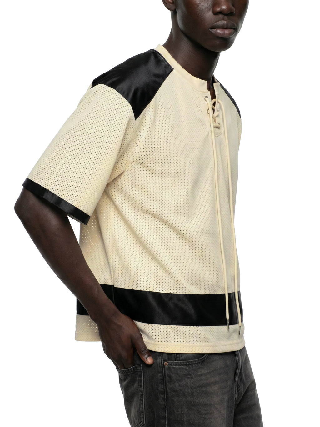 Black male model wearing the NFEO Millions Pending oversized boxy mesh raglan tee in a premium luxury streetwear lifestyle setting, showcasing the [FRONT,RIGHT/VIEW], heavyweight 255 GSM breathable mesh fabric, drop shoulder fit, oversized silhouette, premium craftsmanship, and exclusive entrepreneur-inspired design. Styled with matching NFEO Millions Pending platform sneakers for a complete coordinated streetwear collection. Not For Everyone. Built For The Few.
