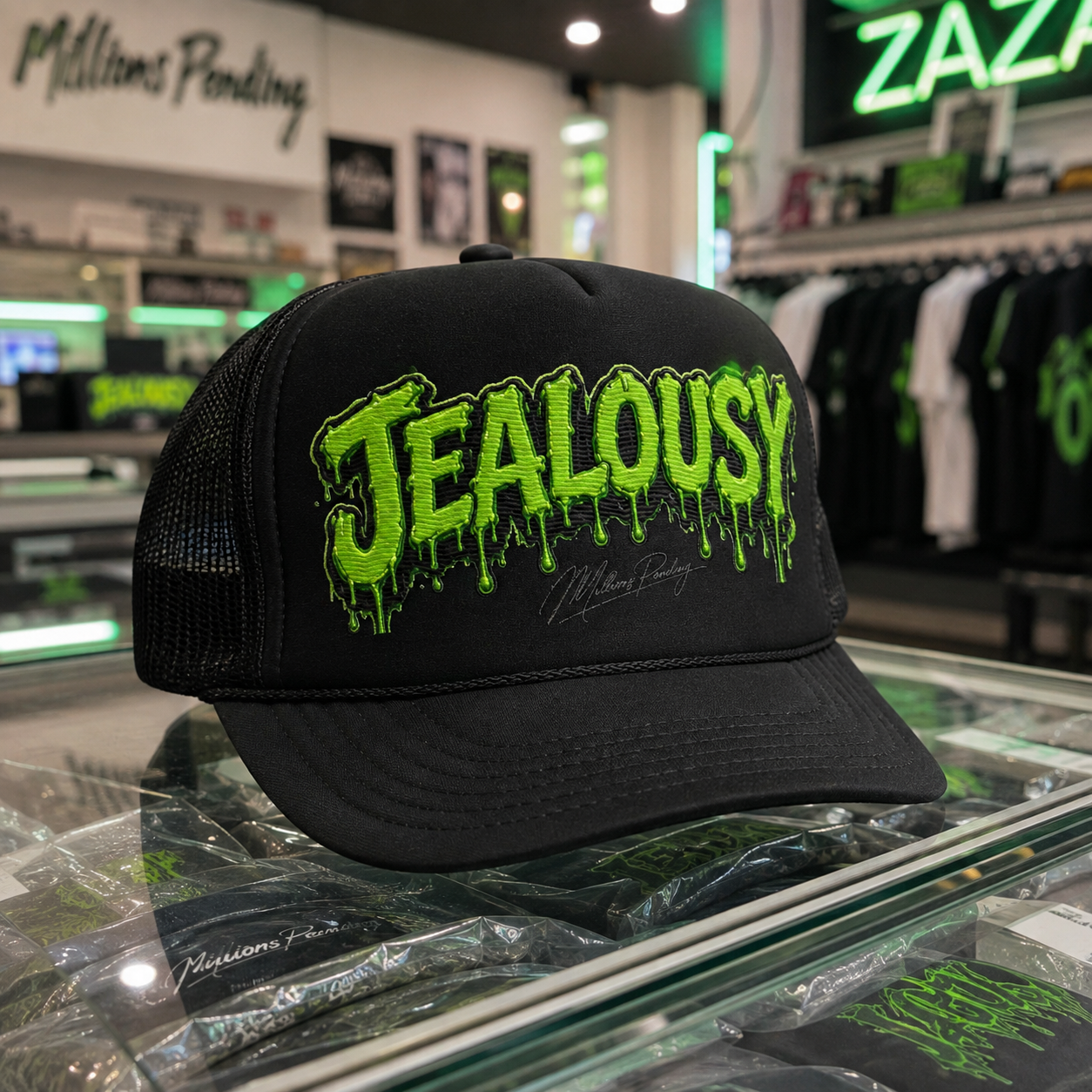 NFEO Black Jealousy cannabis strain foam trucker hat with raised 3D embroidered lettering, stitched streetwear design, black mesh back, and structured foam front displayed on a glass retail counter in an urban dispensary-style shop. Cannabis-inspired streetwear headwear for shoppers seeking embroidered strain hats and statement trucker caps.