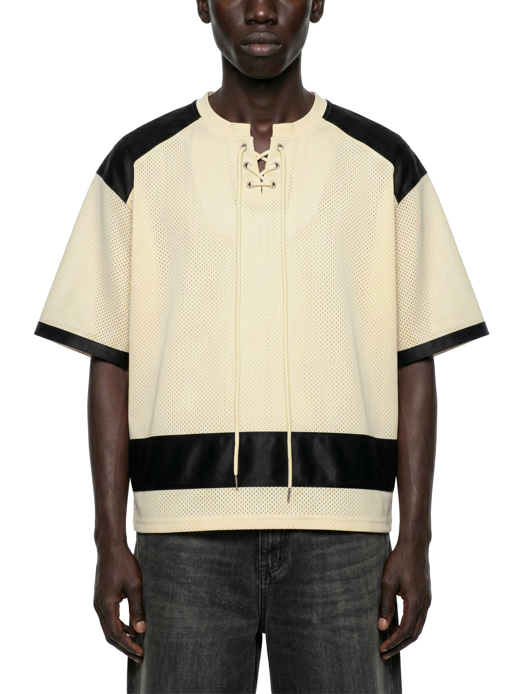 Black male model wearing the NFEO Millions Pending oversized boxy mesh raglan tee in a premium luxury streetwear lifestyle setting, showcasing the [FRONT/VIEW], heavyweight 255 GSM breathable mesh fabric, drop shoulder fit, oversized silhouette, premium craftsmanship, and exclusive entrepreneur-inspired design. Styled with matching NFEO Millions Pending platform sneakers for a complete coordinated streetwear collection. Not For Everyone. Built For The Few.