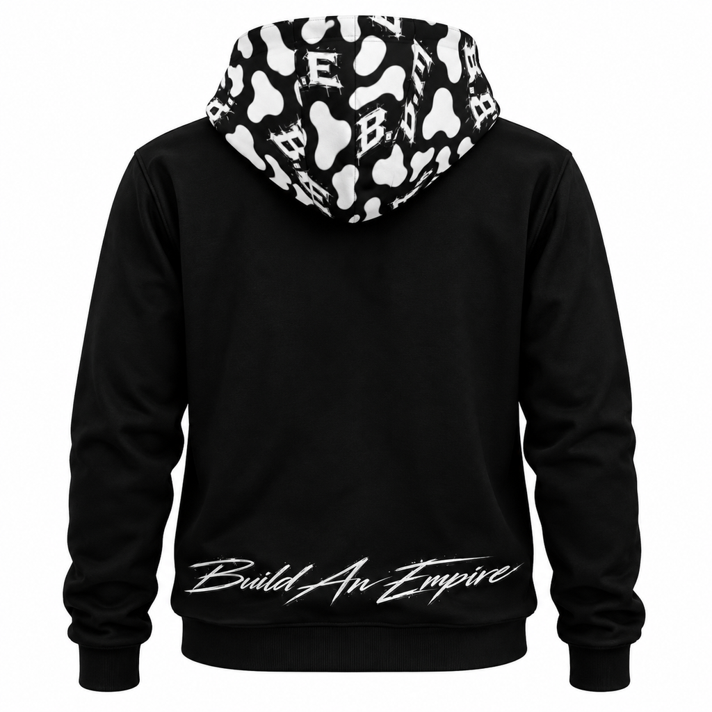 Black B.A.E. hoodie back featuring the signature black-and-white cow-print B.A.E. hood and white “Build An Empire” script across the lower back, showcasing an entrepreneur streetwear design with premium urban fashion styling.