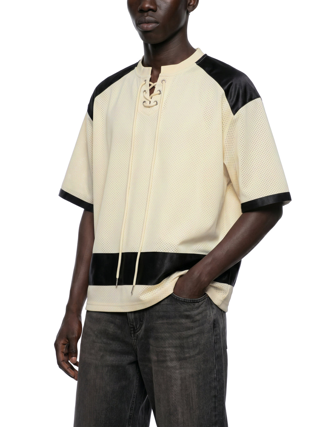Black male model wearing the NFEO Millions Pending oversized boxy mesh raglan tee in a premium luxury streetwear lifestyle setting, showcasing the [FRONTLEFT/VIEW], heavyweight 255 GSM breathable mesh fabric, drop shoulder fit, oversized silhouette, premium craftsmanship, and exclusive entrepreneur-inspired design. Styled with matching NFEO Millions Pending platform sneakers for a complete coordinated streetwear collection. Not For Everyone. Built For The Few.